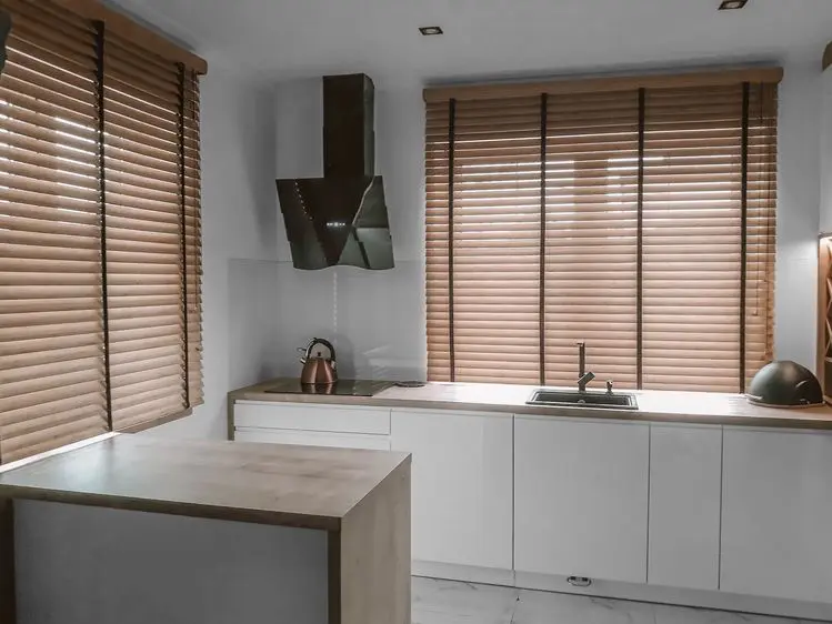 Thick fabric Roman blind fitted to insulate a window