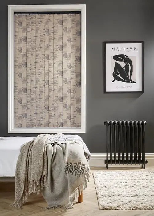 Grey textured vertical blind louvers in a portrait-format window